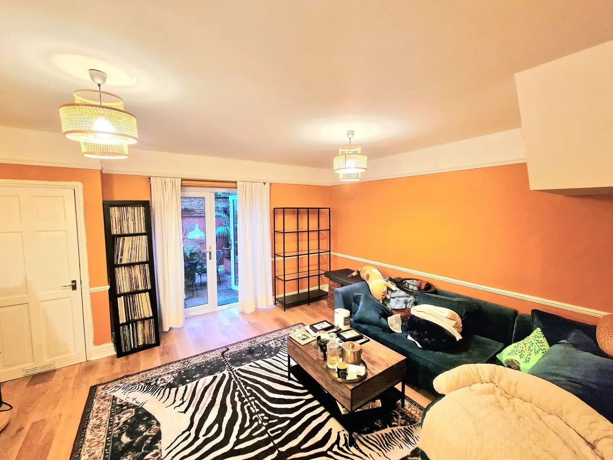 The living room finished in orange with white woodwork