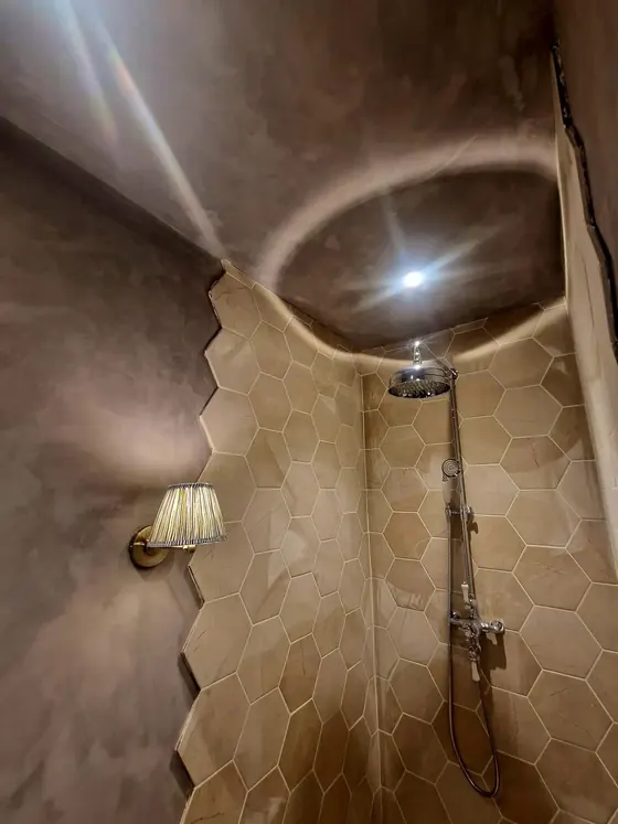 Shower room with a textured grey wall finish