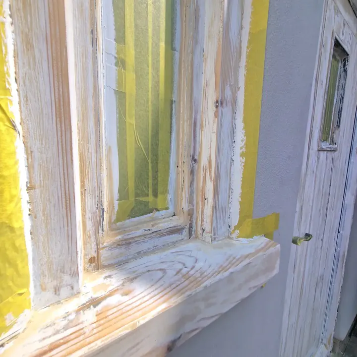 A window sill and frame sanded back to bare wood